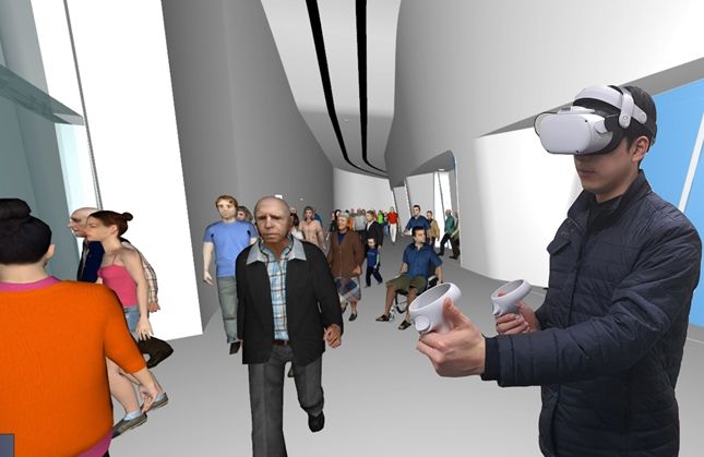 디자인전시관1에서 화재 발생 시나리오, 피난 상황에 대한 피난안내요원의 VR 착용 1인칭 시점※ VR 장비를 착용하여야 1인칭 시점의 교육 효과 가능